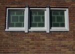 Simpel metselwerk wordt onderbroken door een apart raam.
<br/>
Richard Keijzer, 2015-04-20